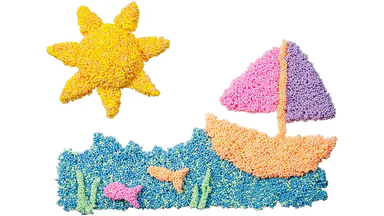 Playfoam shaped into a sailboat on the ocean