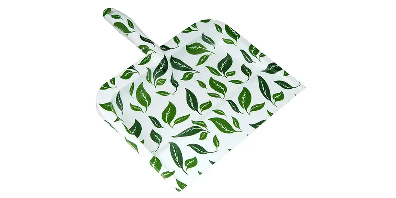 A cute, leafy dustpan has a sharp, strong edge.