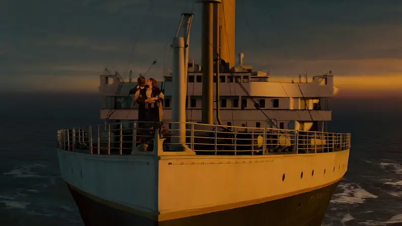 Jack (Leonardo DiCaprio) and Rose (Kate Winslet) kissing on the deck of the HMS Titanic.