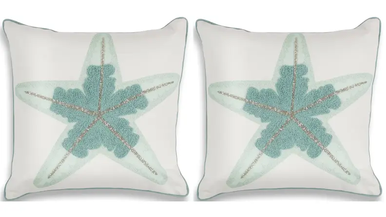Blue starfish on a white pillow