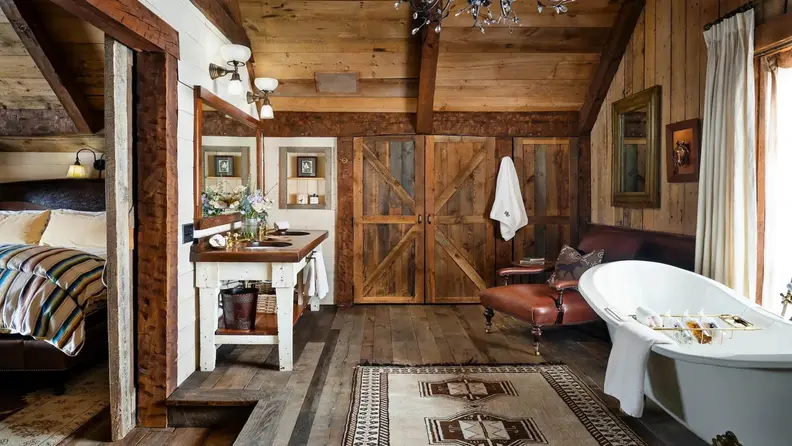 A living space showing the original exposed-rafter ceilings with luxurious furnitures and fixtures