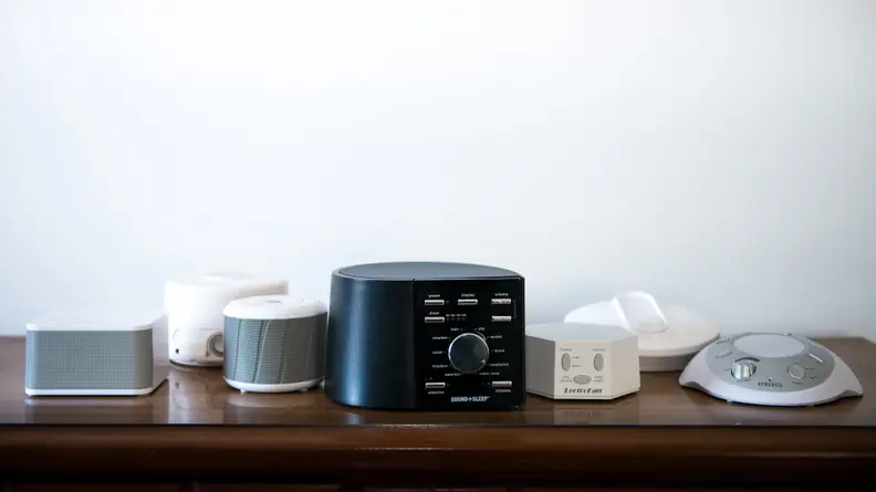 Different white noise machines on a table