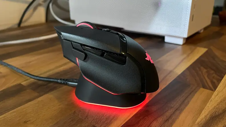 The mouse sitting idly being charged with the red LED light turned on.