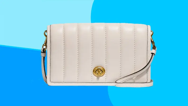White leather crossbody bag on a blue background