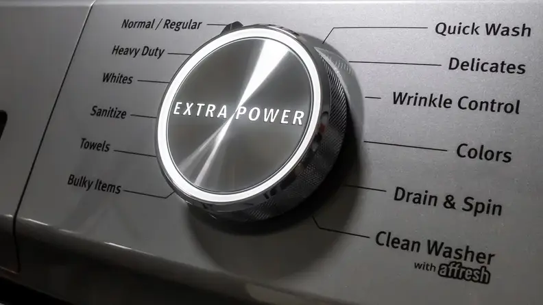 A giant, imposing cycle select dial with an all-caps "EXTRA POWER" written across its center.