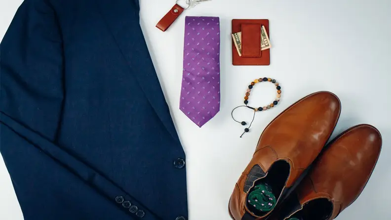 shoes, key chain, and tie in box