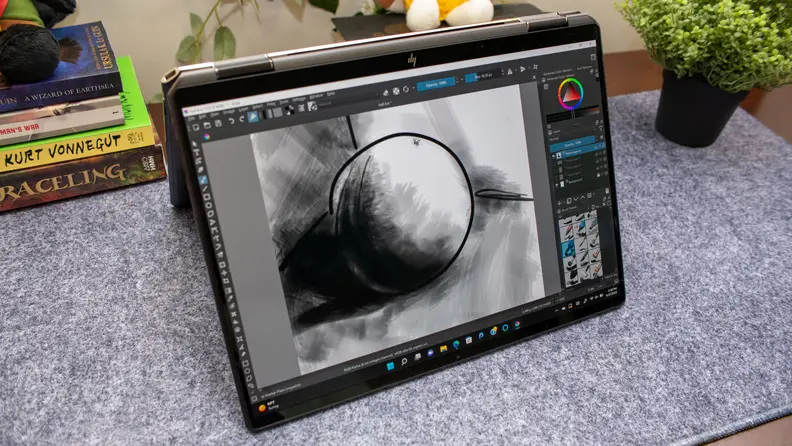 The HP Spectre in stand-mode on a marble counter.