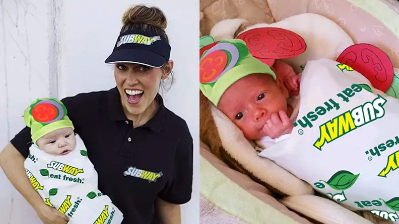 A parent dressed as a Subway worker holds a baby dressed as a sandwich.
