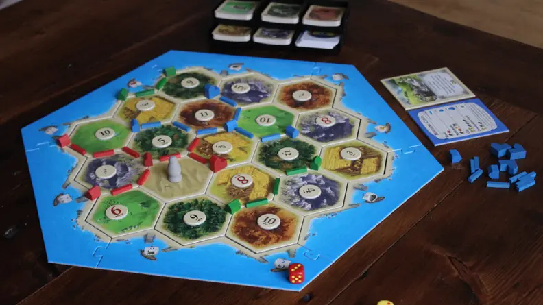 Catan is a German-style board game that's played with three or four people.