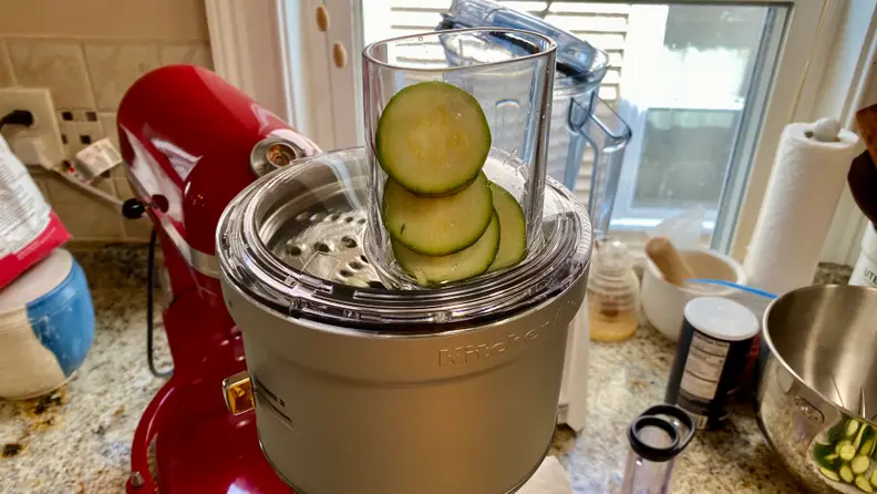 You can grate zucchini into small pieces using a food processor or a box grater.