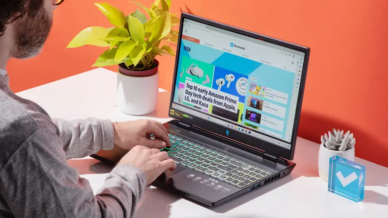 A person interacting with the Acer Nitro 16.