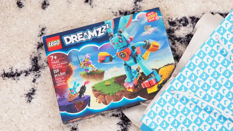 A box of LEGOs next to Reviewed gift boxes.