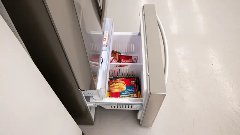 A close-up of the freezer drawer opened, with its inset drawer pulled out slightly.