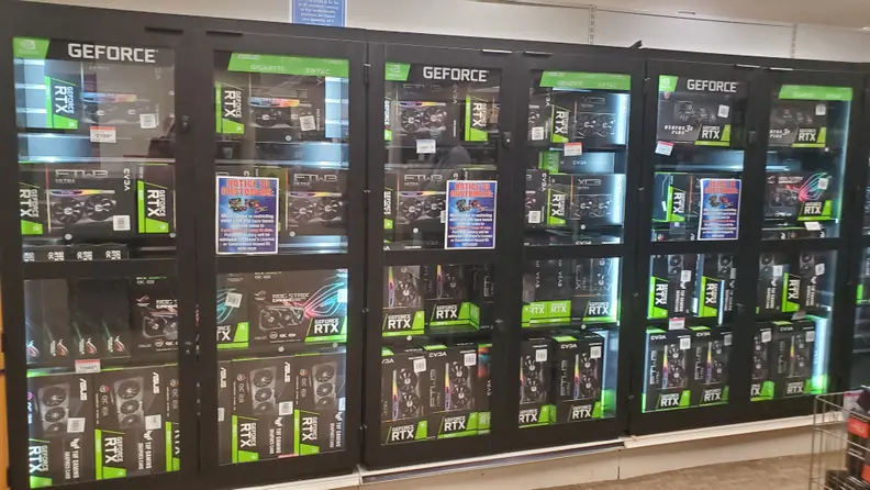 A store aisle with graphics cards on display.