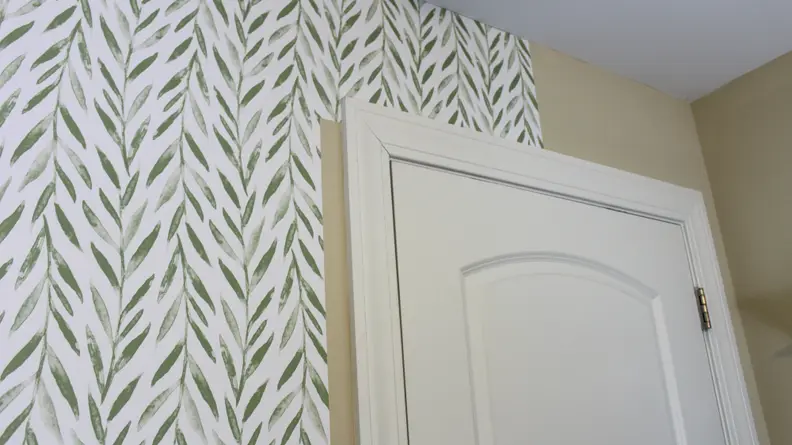 We ended up with a tiny gap between the paper and the door frame.