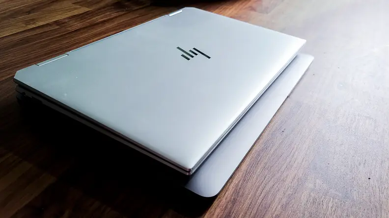 The HP Spectre x360 13t on top of the MacBook Air (2020)
