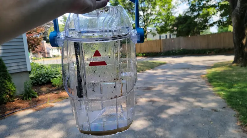 An empty dirty water tank on the bissell little green pro