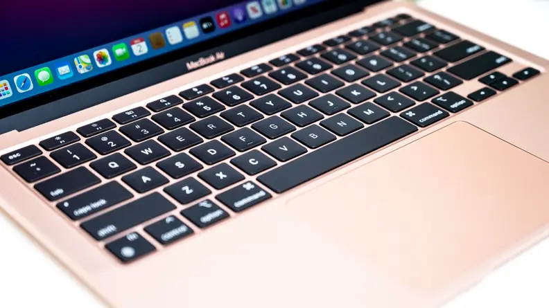 The keyboard of a MacBook Air laptop: smooth, flat black keys.