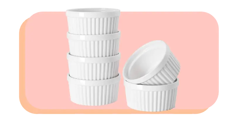 Stack of white ramekins stacked on top of each other.