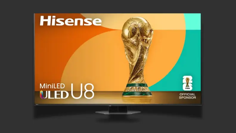 A TV with a colorful screen sits on a black background