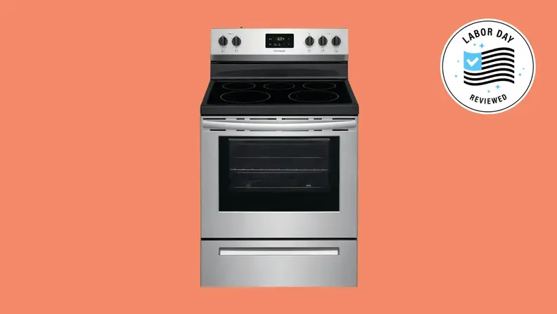 A silver electric range on a salmon background that has a Labor Day badge.