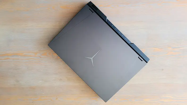Top-down view of a laptop on a coffee table.