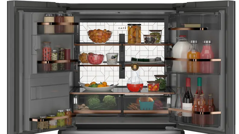 The back-lit interior of the Café CVE28DM5NBS5 French door refrigerator.