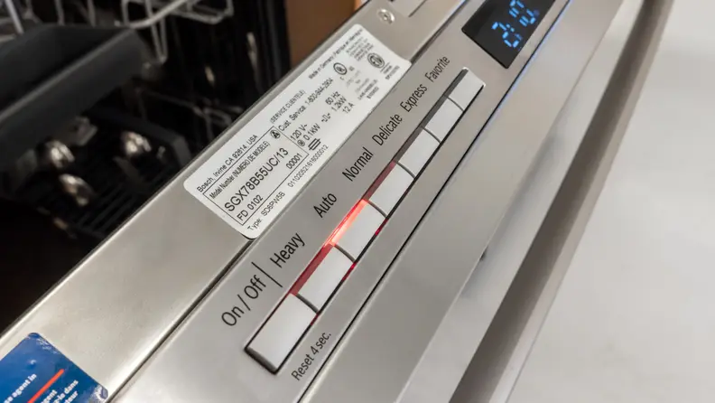 A close-up of the control panel, which features raised, rectangular buttons.