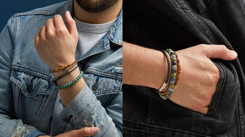 man holding bracelets on wrist