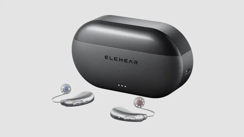 A black oval charging case with two hearing aids