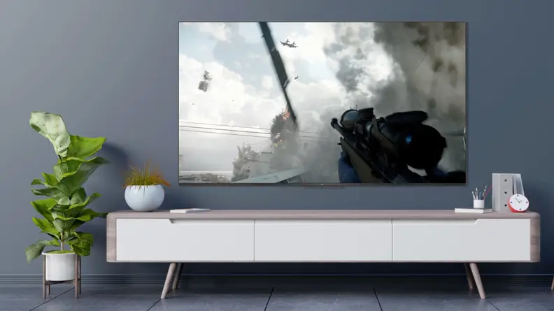 The TCL 5-Series with Google TV displaying a simulation of video game content