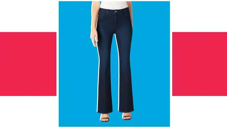 A model wears dark blue denim high-waisted bell bottom pants.