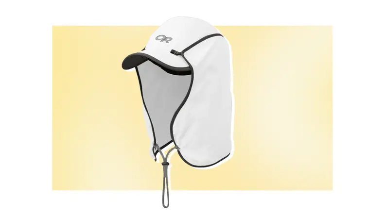 A white and black sun cap with protective flaps against a yellow background.