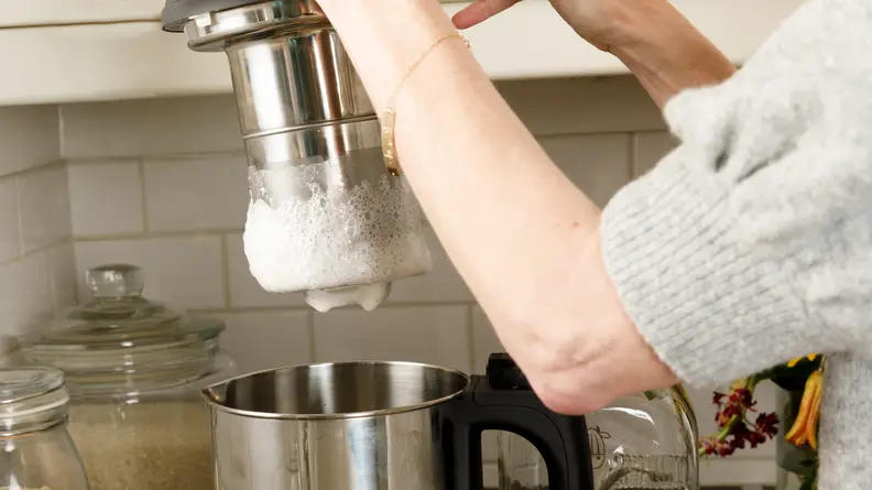 The Almond Cow has a built-in blender and filter basket.