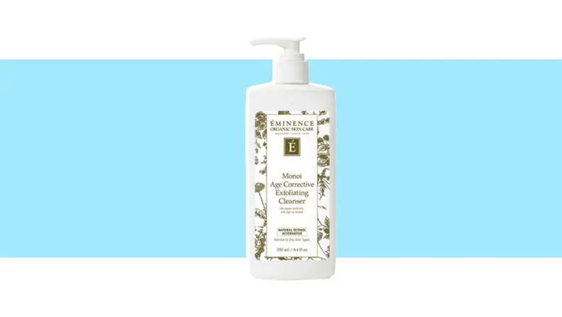 A container of face cleanser against a blue background.