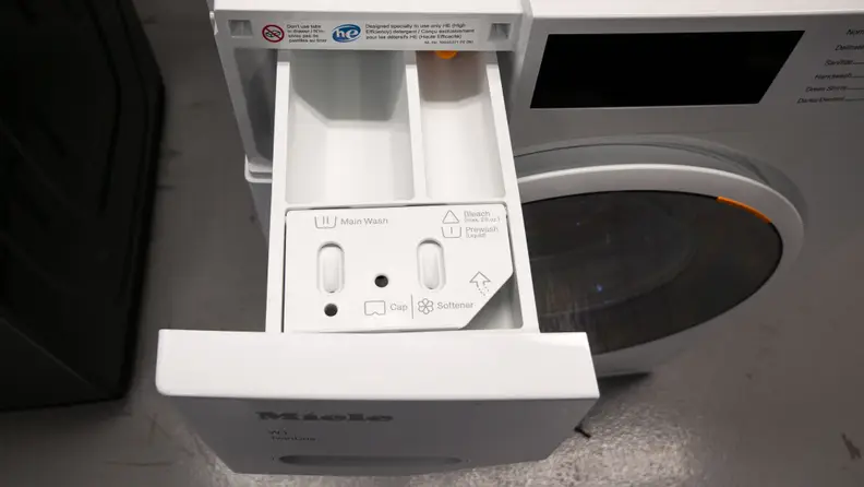 A close-up of the detergent dispenser on the Miele washer.