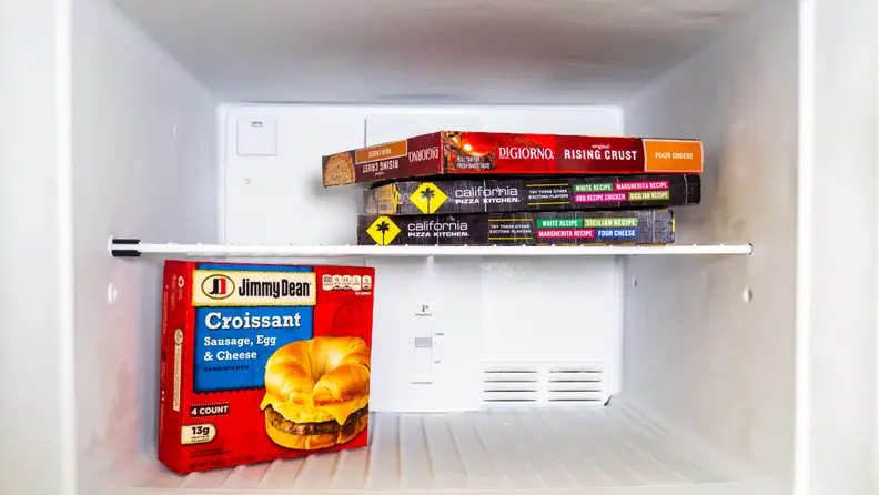 A shot of the interior of the Frigidaire FFTR2021TS refrigerator's freezer, with a few items included for scale.