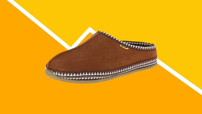 A pair of brown slippers against a yellow background.