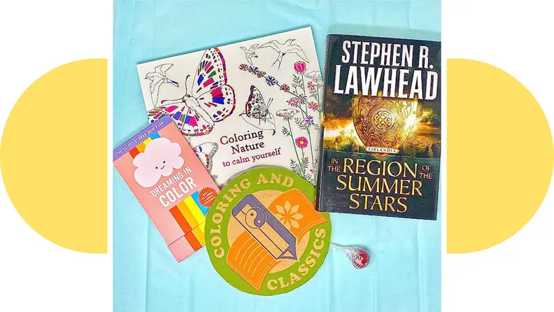 Three different coloring books from the Coloring And Classics subscription box.