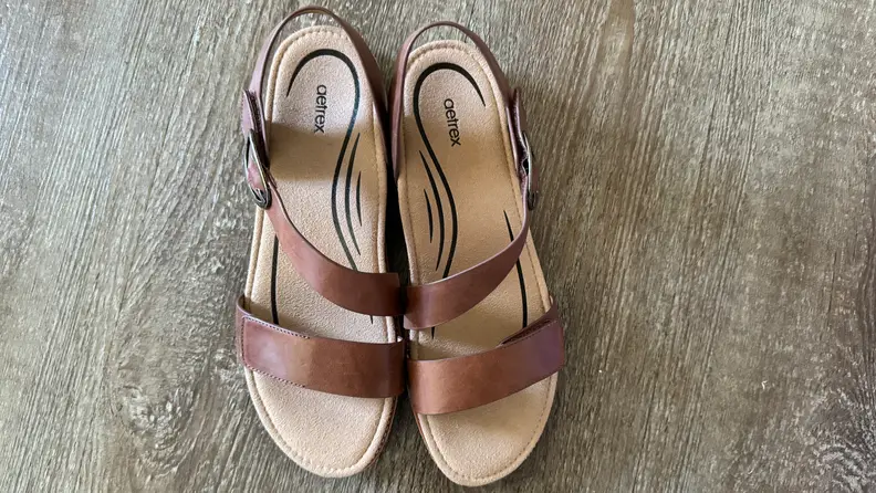A pair of Tamara Aetrex sandals