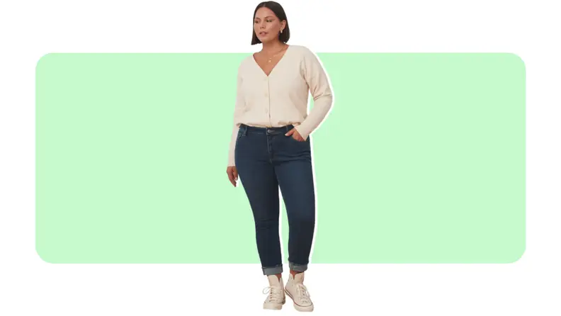 A model wears dark blue jeans with a cream blouse.