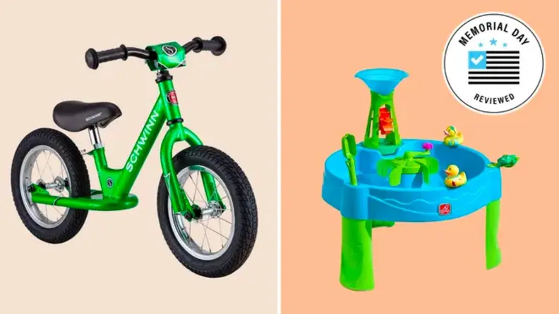 A kid's bicycle shown next to a water activity table for kids.