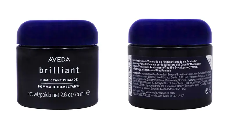 The front and back of a dark blue jar from Aveda.