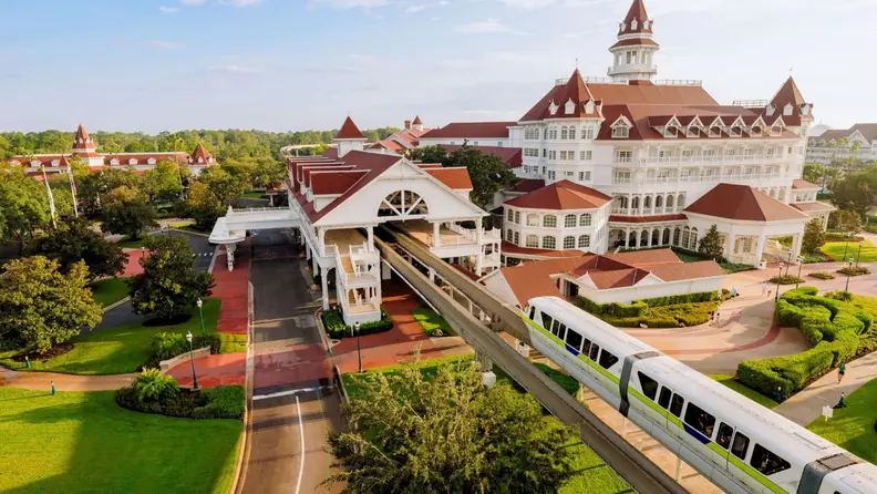 A Victorian-style Disney resort showing their very own monorail bound for the hotel