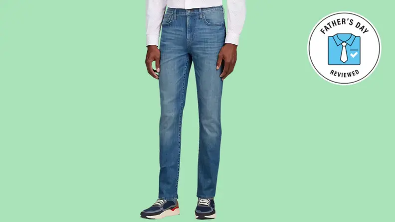 medium wash men's jeans on lime green background
