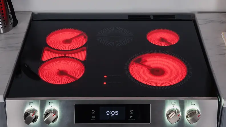 Frigidaire Gallery cooktop with all heating elements turned on and glowing red.