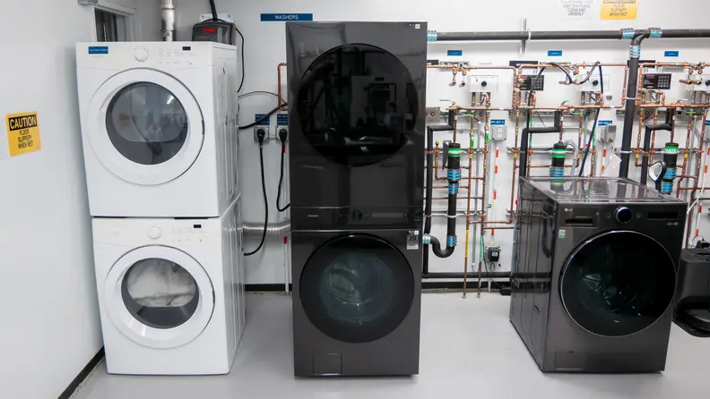 The Samsung Bespoke WH46DBH500EVA3 tower washer and dryer inside of a testing lab.