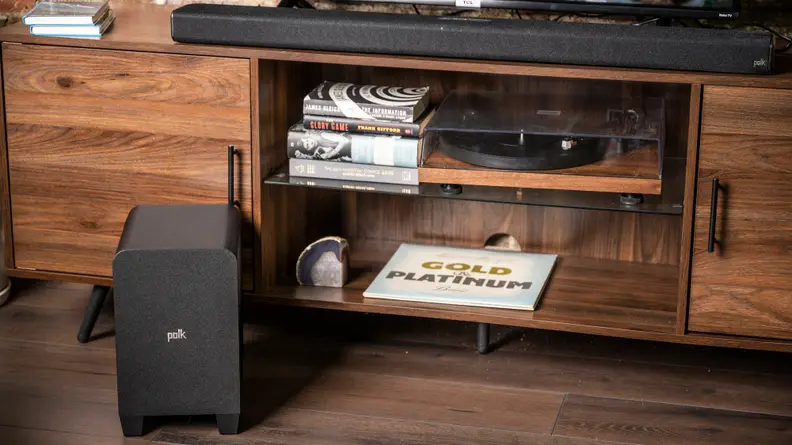 A wide shot of both the Signa S4 soundbar and subwoofer