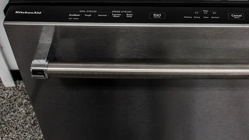 The top-mounted controls of a KitchenAid KDTE234GPS dishwasher.