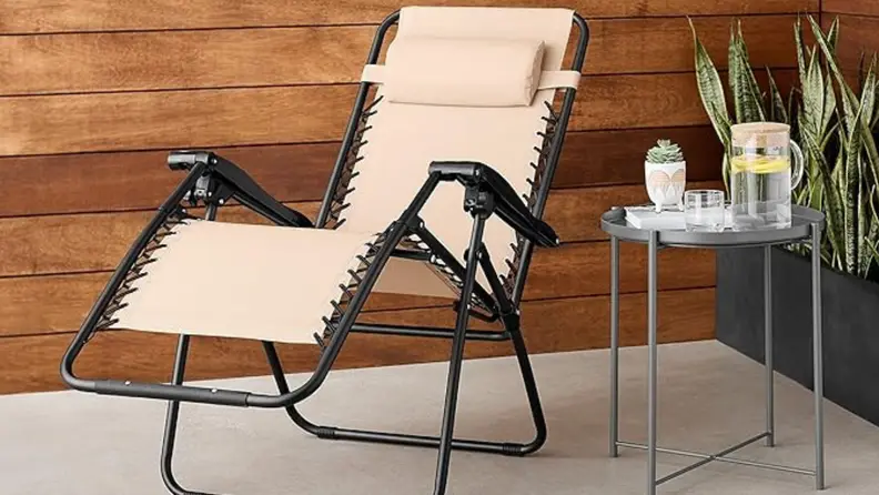 beige and black reclining outdoor chair next to drink cart